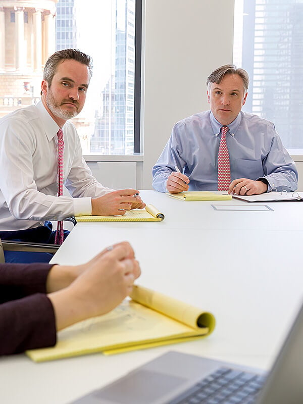 Two attorneys sitting at conference table